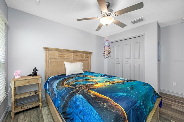 31775 Sun Kettle Loop, Wesley Chapel, FL 33545 - bedroom with wood finished floors, a closet, baseboards, and ceiling fan