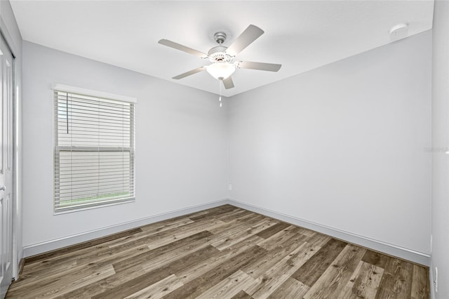 31775 Sun Kettle Loop, Wesley Chapel, FL 33545 - empty room with wood finished floors, a ceiling fan, baseboards, and a smoke detector