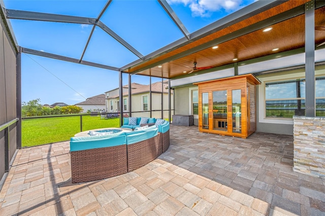 31775 Sun Kettle Loop, Wesley Chapel, FL 33545 - view of patio featuring outdoor lounge area, a ceiling fan, and a lanai