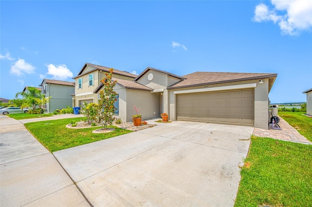 31775 Sun Kettle Loop, Wesley Chapel, FL 33545 - view of front of home with stucco siding, driveway, a front yard, and an attached garage