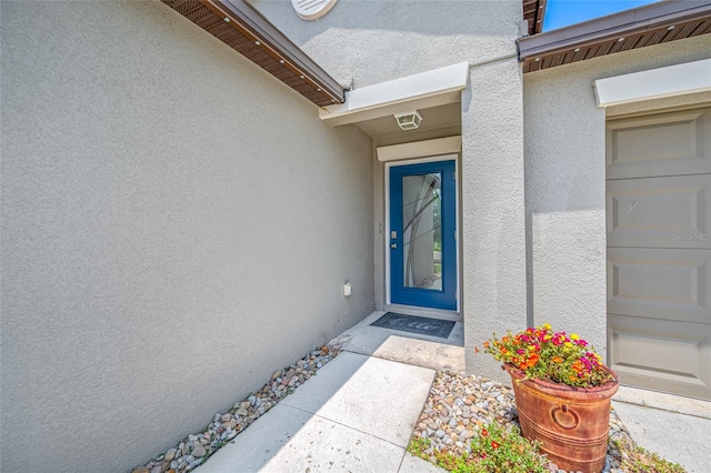31775 Sun Kettle Loop, Wesley Chapel, FL 33545 - view of exterior entry featuring stucco siding