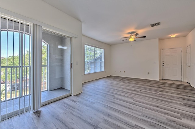 13025 Sanctuary Cove Dr Unit 301, Temple Terrace, FL 33637 - entryway featuring light wood-style floors, ceiling fan, and baseboards