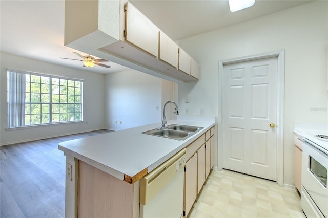 13025 Sanctuary Cove Dr Unit 301, Temple Terrace, FL 33637 - kitchen featuring white appliances, a sink, a peninsula, light floors, and light countertops