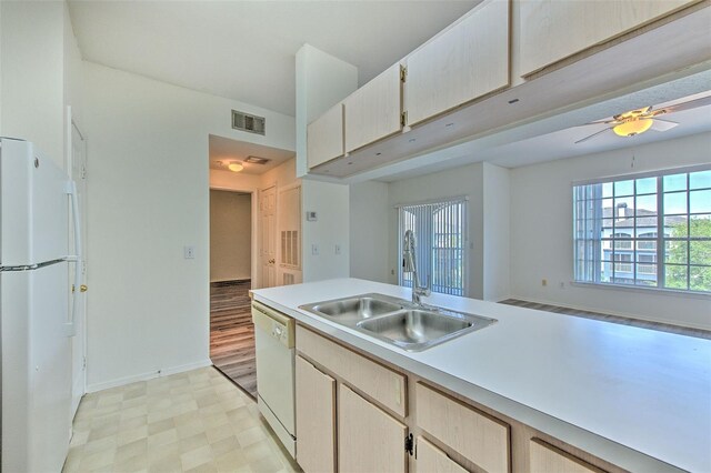 13025 Sanctuary Cove Dr Unit 301, Temple Terrace, FL 33637 - kitchen with white appliances, a sink, light floors, light countertops, and a ceiling fan