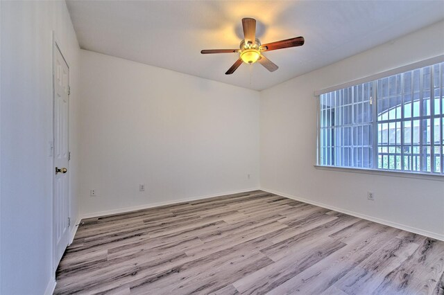 13025 Sanctuary Cove Dr Unit 301, Temple Terrace, FL 33637 - unfurnished room with wood finished floors, a ceiling fan, and baseboards