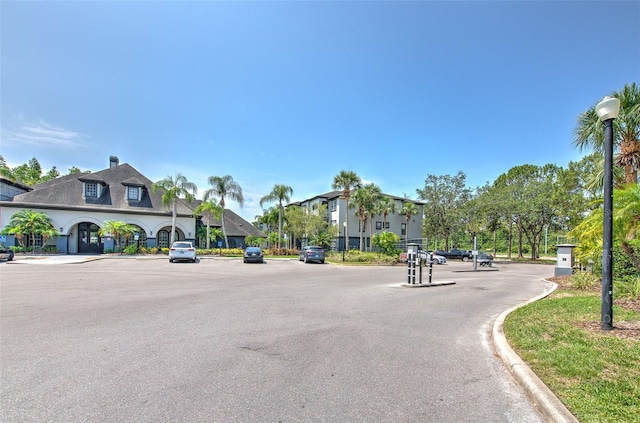 13025 Sanctuary Cove Dr Unit 301, Temple Terrace, FL 33637 - view of asphalt street with curbs and street lighting