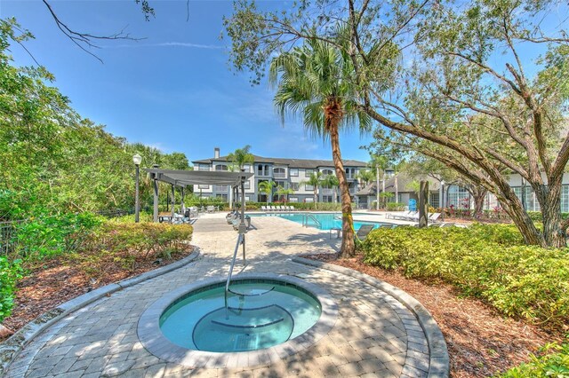 13025 Sanctuary Cove Dr Unit 301, Temple Terrace, FL 33637 - community pool with a hot tub