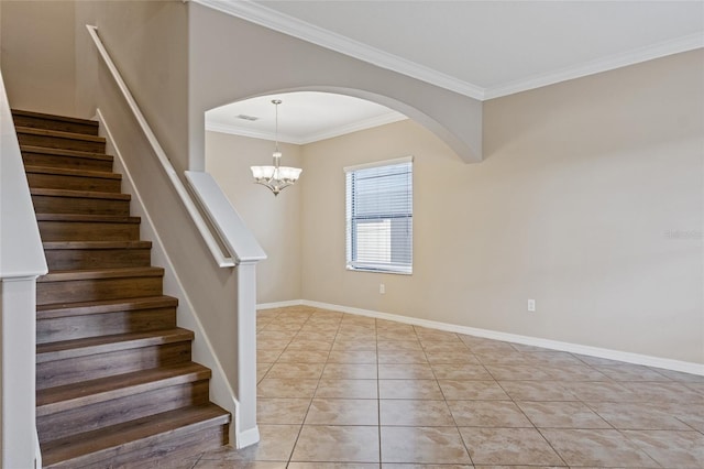 10808 Whitecap Dr, Riverview, FL 33579 - stairs featuring ornamental molding, arched walkways, tile patterned flooring, and a chandelier
