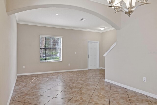 10808 Whitecap Dr, Riverview, FL 33579 - foyer entrance with arched walkways, ornamental molding, and a chandelier