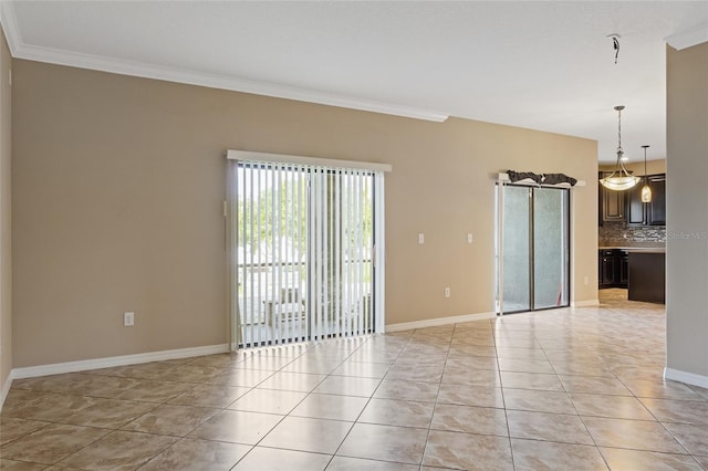 10808 Whitecap Dr, Riverview, FL 33579 - unfurnished room with crown molding and light tile patterned flooring