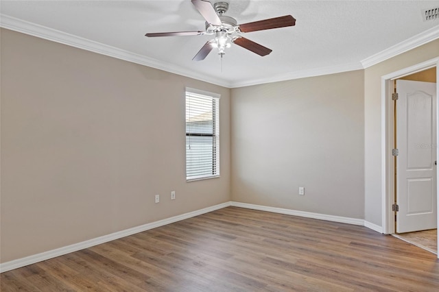 10808 Whitecap Dr, Riverview, FL 33579 - spare room with crown molding, wood finished floors, and ceiling fan