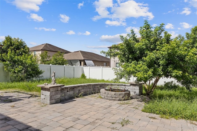 10808 Whitecap Dr, Riverview, FL 33579 - fenced backyard with a patio area and a fire pit