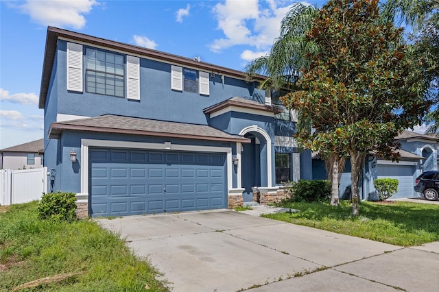 10808 Whitecap Dr, Riverview, FL 33579 - view of front of house with stucco siding, driveway, an attached garage, and stone siding