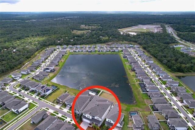 3063 Marine Grass Dr, Wimauma, FL 33598 - aerial overview of property's location featuring a forest, nearby suburban area, and a nearby body of water
