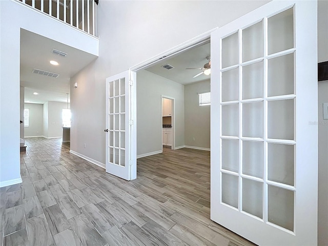 3063 Marine Grass Dr, Wimauma, FL 33598 - spare room with ceiling fan, baseboards, and french doors
