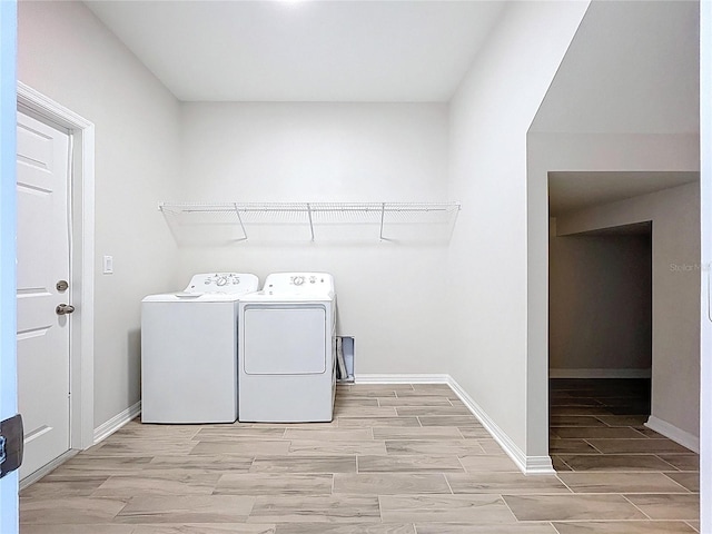 3063 Marine Grass Dr, Wimauma, FL 33598 - washroom with wood finished floors, independent washer and dryer, and baseboards