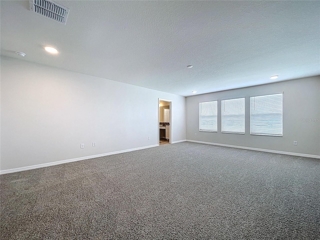 3063 Marine Grass Dr, Wimauma, FL 33598 - unfurnished room with carpet flooring, recessed lighting, baseboards, a textured ceiling, and a smoke detector