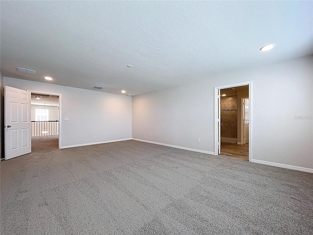 3063 Marine Grass Dr, Wimauma, FL 33598 - unfurnished room featuring recessed lighting, baseboards, carpet floors, and a textured ceiling