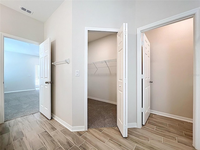 3063 Marine Grass Dr, Wimauma, FL 33598 - corridor with wood finish floors and baseboards
