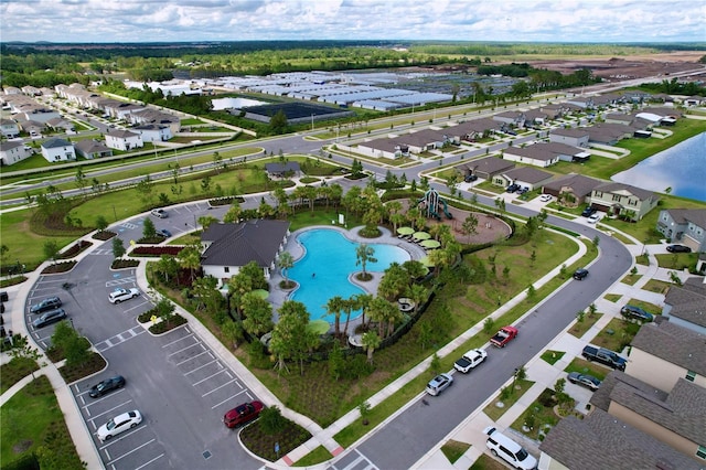 3063 Marine Grass Dr, Wimauma, FL 33598 - aerial view of property's location featuring a pool area, nearby suburban area, and a large body of water