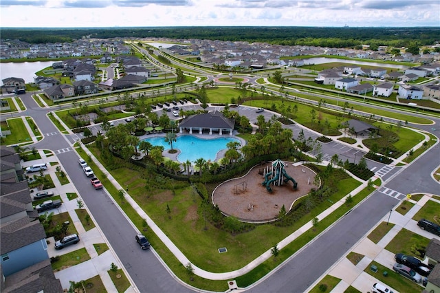 3063 Marine Grass Dr, Wimauma, FL 33598 - aerial view of property's location with nearby suburban area, a pool, and a nearby body of water