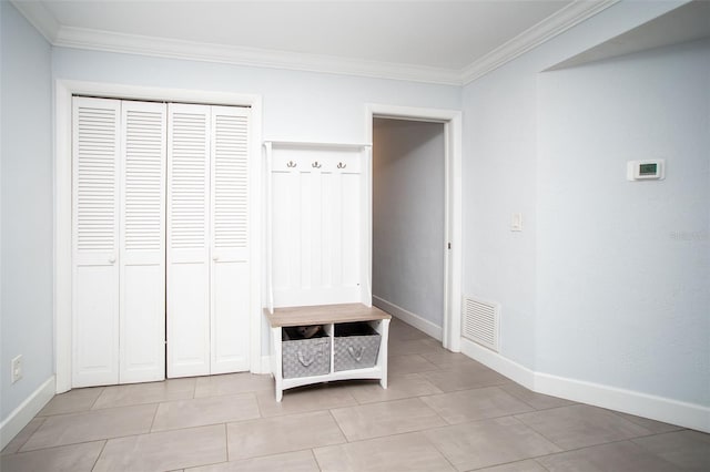 11071 141st St, Largo, FL 33774 - mudroom with crown molding, baseboards, and light tile patterned flooring