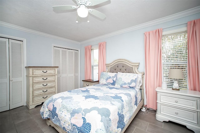11071 141st St, Largo, FL 33774 - bedroom with multiple closets, ornamental molding, and a ceiling fan