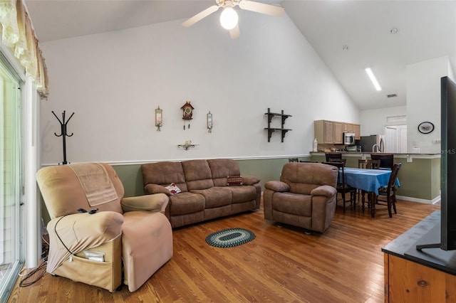 13200 W Newberry Rd Unit B8, Newberry, FL 32669 - living area featuring high vaulted ceiling, light wood finished floors, and ceiling fan