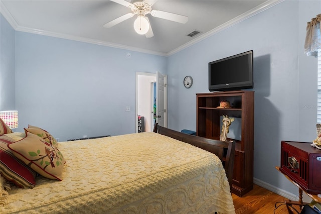 13200 W Newberry Rd Unit B8, Newberry, FL 32669 - bedroom featuring wood finished floors, ornamental molding, baseboards, and a ceiling fan