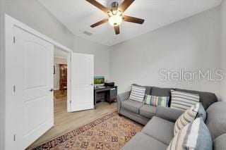 1528 Highland Park Dr, Clearwater, FL 33756 - living area featuring wood finished floors and a ceiling fan