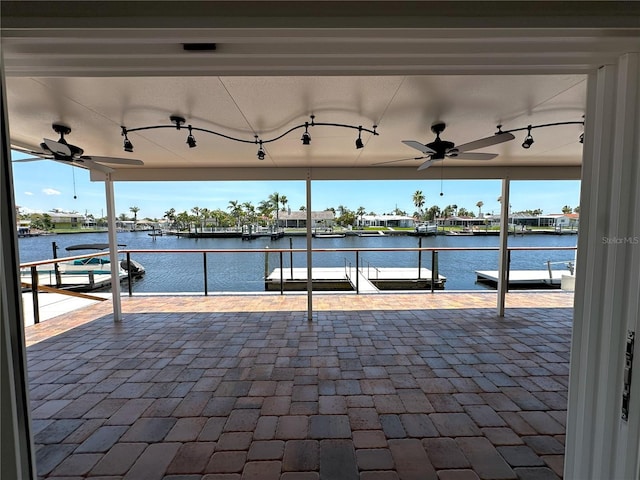 3654 Corsair Ct, New Port Richey, FL 34652 - view of patio featuring a ceiling fan, a water view, and a dock
