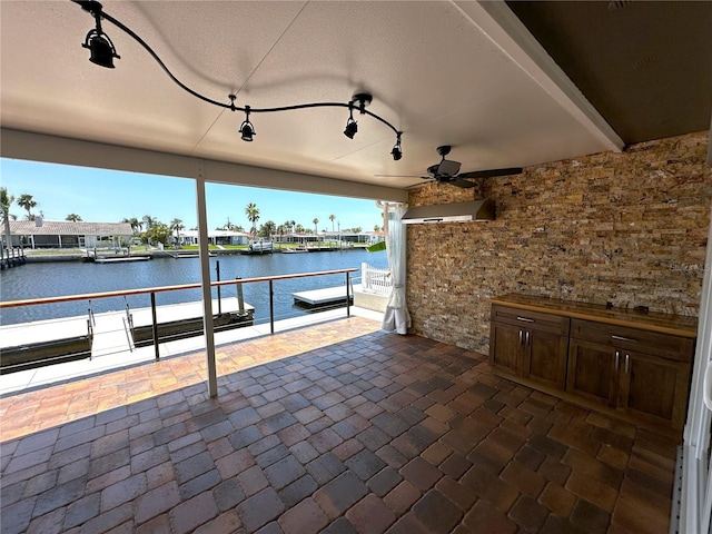 3654 Corsair Ct, New Port Richey, FL 34652 - view of patio with a water view, exterior kitchen, and ceiling fan