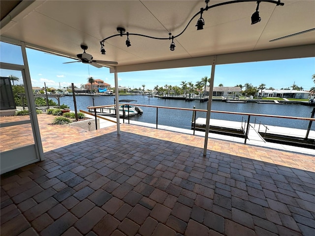 3654 Corsair Ct, New Port Richey, FL 34652 - view of patio with a water view, a boat dock, and ceiling fan