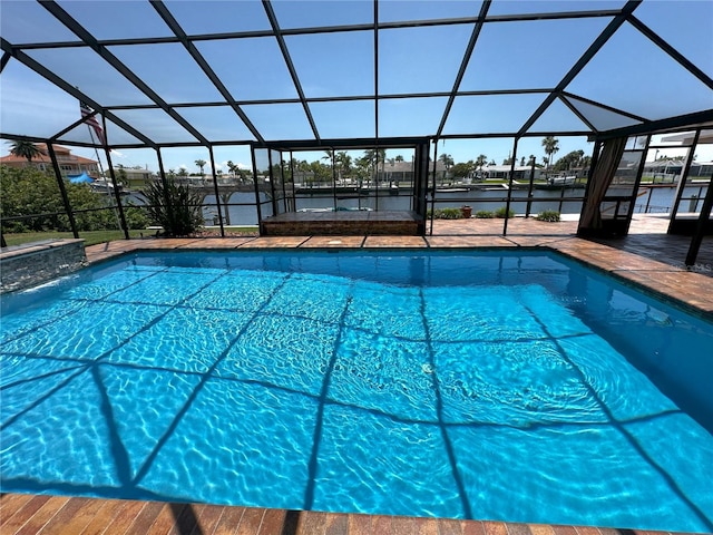 3654 Corsair Ct, New Port Richey, FL 34652 - outdoor pool featuring a water view, glass enclosure, and a patio