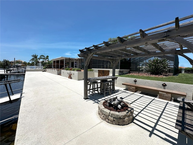 3654 Corsair Ct, New Port Richey, FL 34652 - view of patio / terrace featuring a fire pit and a pergola