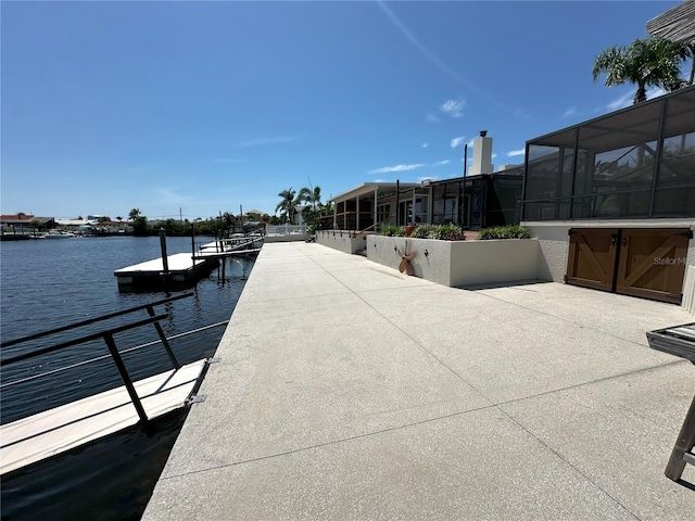 3654 Corsair Ct, New Port Richey, FL 34652 - dock area featuring a water view and glass enclosure