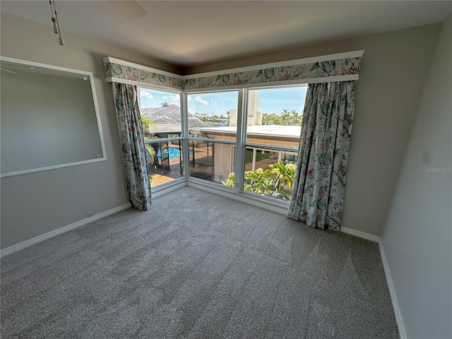 3654 Corsair Ct, New Port Richey, FL 34652 - carpeted spare room featuring baseboards