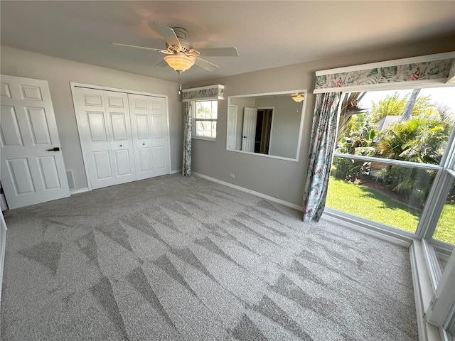 3654 Corsair Ct, New Port Richey, FL 34652 - unfurnished bedroom featuring carpet floors, baseboards, a closet, and ceiling fan