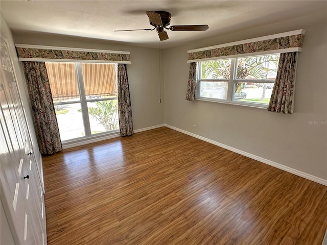 3654 Corsair Ct, New Port Richey, FL 34652 - empty room featuring baseboards, wood finished floors, and ceiling fan