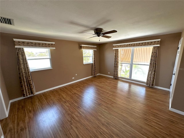 3654 Corsair Ct, New Port Richey, FL 34652 - empty room with ceiling fan, wood finished floors, and baseboards
