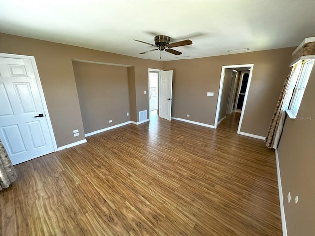 3654 Corsair Ct, New Port Richey, FL 34652 - unfurnished bedroom featuring wood finished floors, baseboards, and ceiling fan