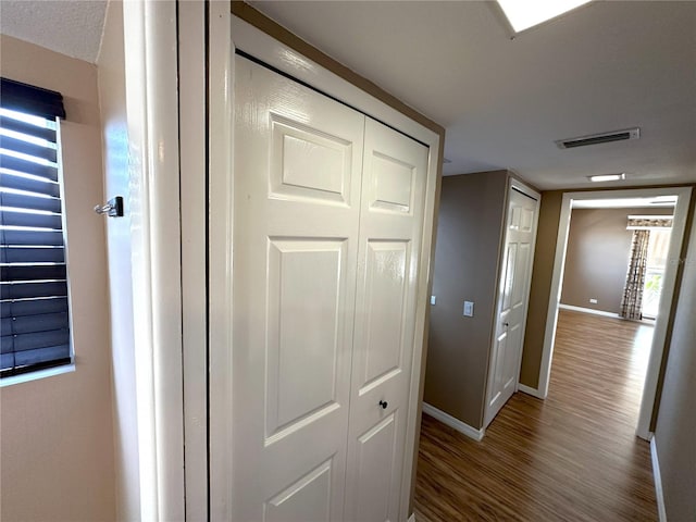 3654 Corsair Ct, New Port Richey, FL 34652 - hall with baseboards and wood finished floors