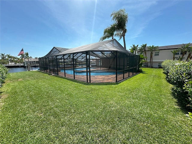 3654 Corsair Ct, New Port Richey, FL 34652 - outdoor pool with a yard, a water view, glass enclosure, and a patio area