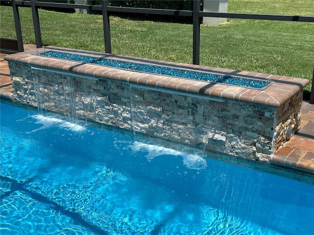 3654 Corsair Ct, New Port Richey, FL 34652 - view of pool with a lawn and a pool with connected hot tub