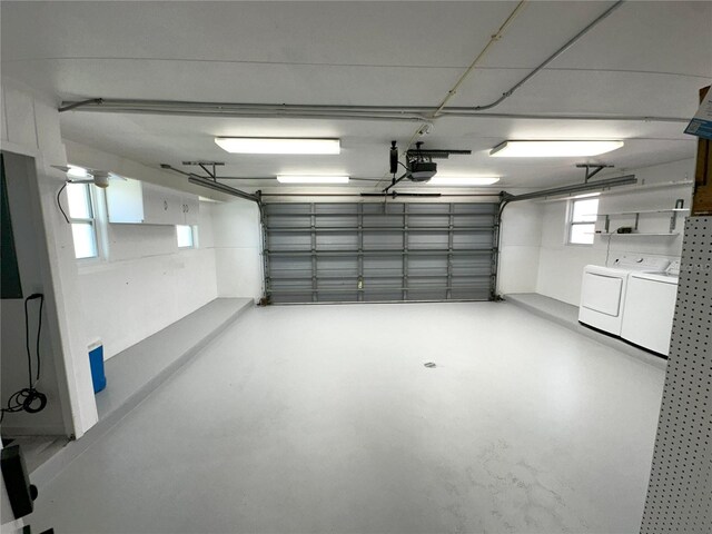 3654 Corsair Ct, New Port Richey, FL 34652 - garage featuring washing machine and clothes dryer and a garage door opener