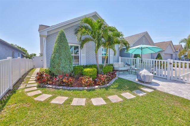 214 Lookout Dr, Apollo Beach, FL 33572 - view of front of home with brick siding and a patio area