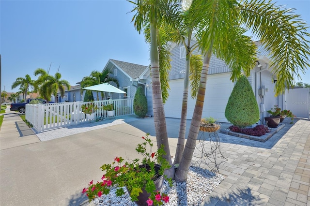 214 Lookout Dr, Apollo Beach, FL 33572 - view of side of home with a garage and concrete driveway