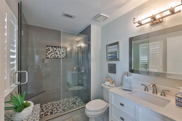 214 Lookout Dr, Apollo Beach, FL 33572 - full bath with toilet, vanity, a stall shower, and a textured ceiling