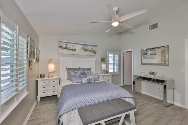 214 Lookout Dr, Apollo Beach, FL 33572 - bedroom featuring wood finish floors, lofted ceiling, baseboards, and ceiling fan