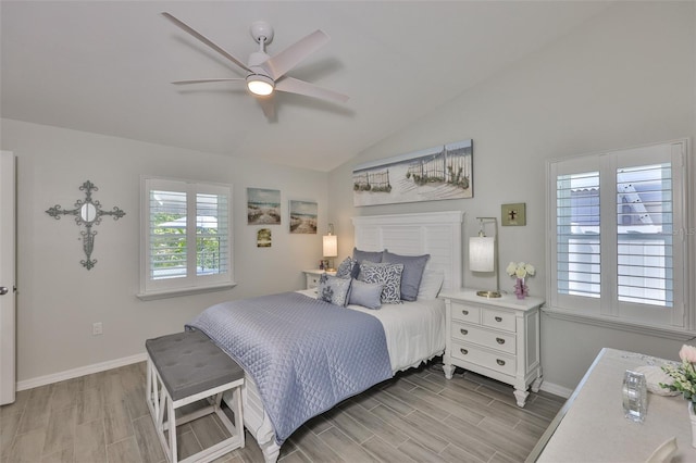 214 Lookout Dr, Apollo Beach, FL 33572 - bedroom with wood finish floors, lofted ceiling, baseboards, and a ceiling fan